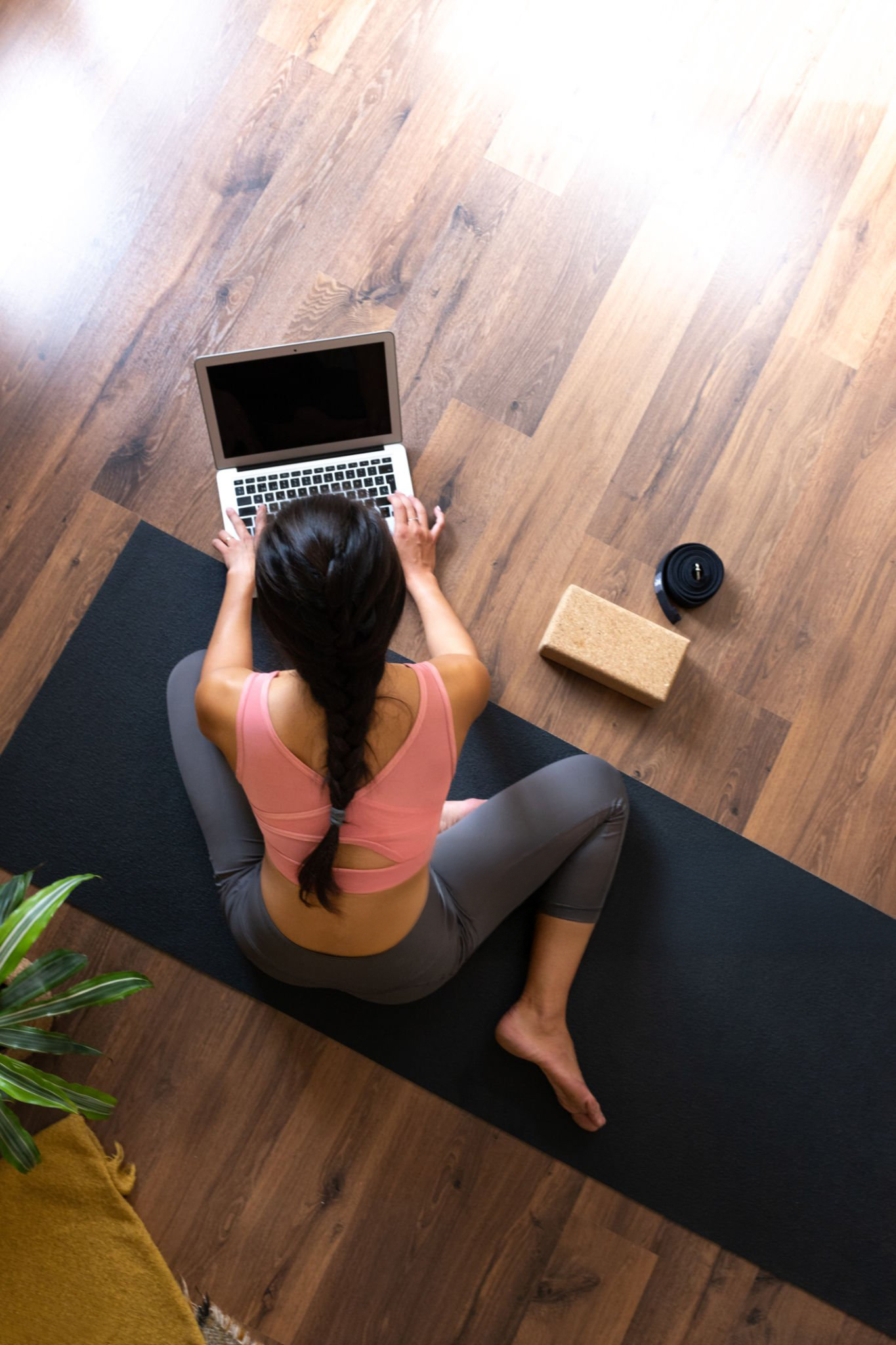 Woman in sports clothes using a laptop